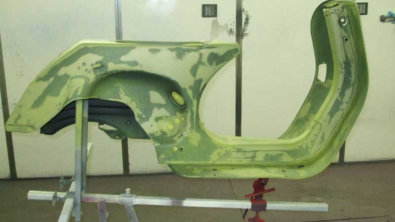 A scooter that is getting ready for paint